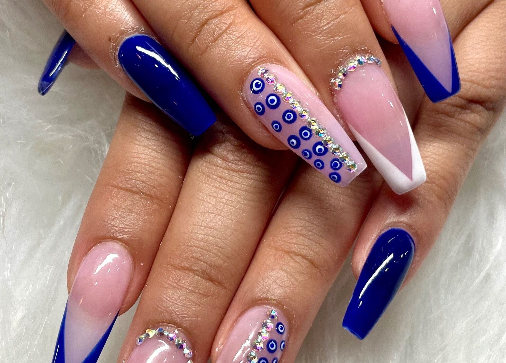 Elegant blue nail art design at Aladdin Nails & Spa, Ocoee, Florida, US showcasing intricate details.