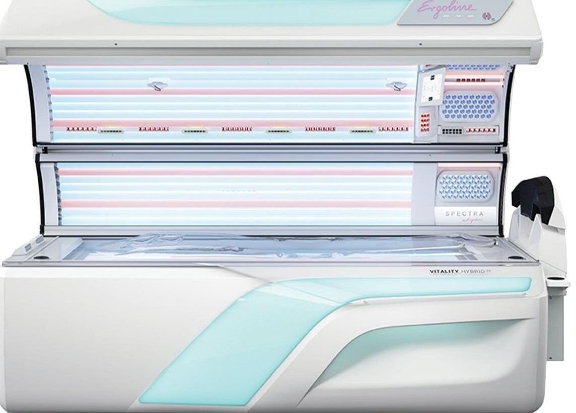 Modern tanning bed at FIV5 Tanning & Barbering, Sandy, England, GB. Sleek design for optimal sunless tanning experience.