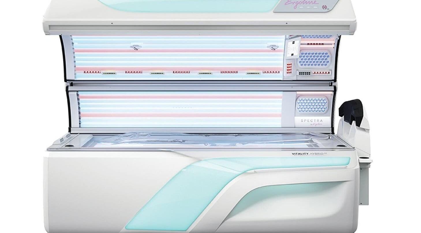 Modern tanning bed at FIV5 Tanning & Barbering, Sandy, England, GB. Sleek design for optimal sunless tanning experience.