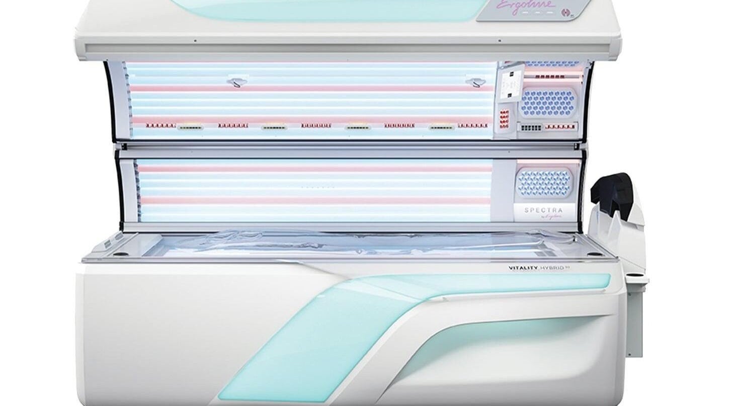 Modern tanning bed at FIV5 Tanning & Barbering, Sandy, England, GB. Sleek design for optimal sunless tanning experience.