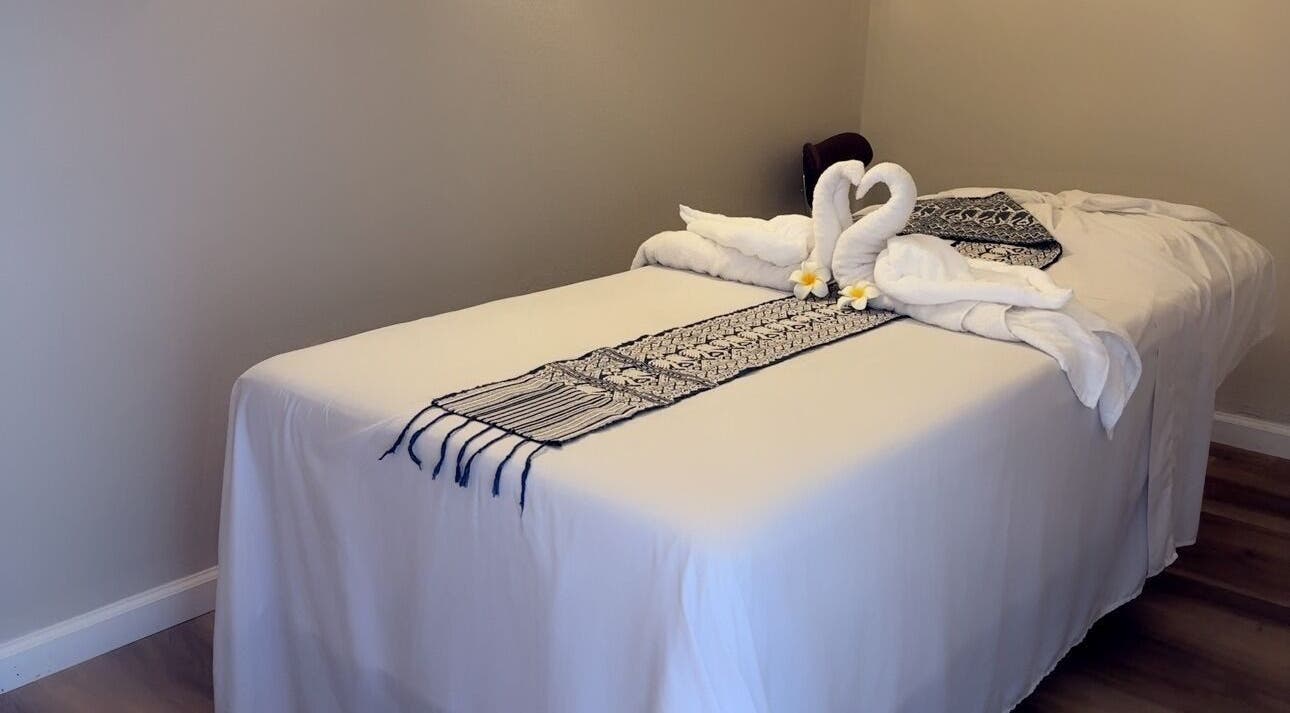 Luxurious massage table setup with towel swans at Las Vegas's Luxurious Expert in Relaxation, Las Vegas, Nevada, US.