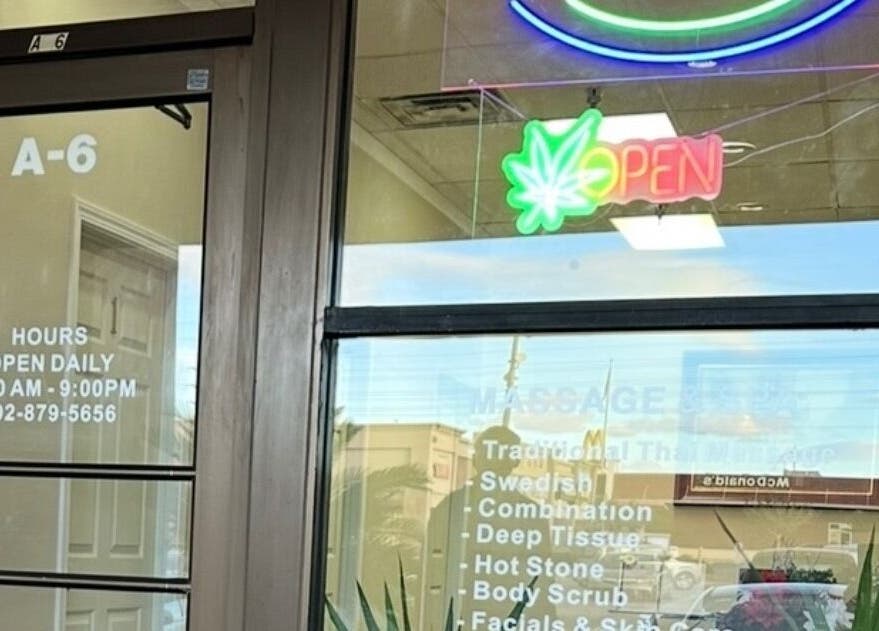Entrance to Las Vegas's Luxurious Expert in Relaxation in Las Vegas, Nevada, US with neon open sign.