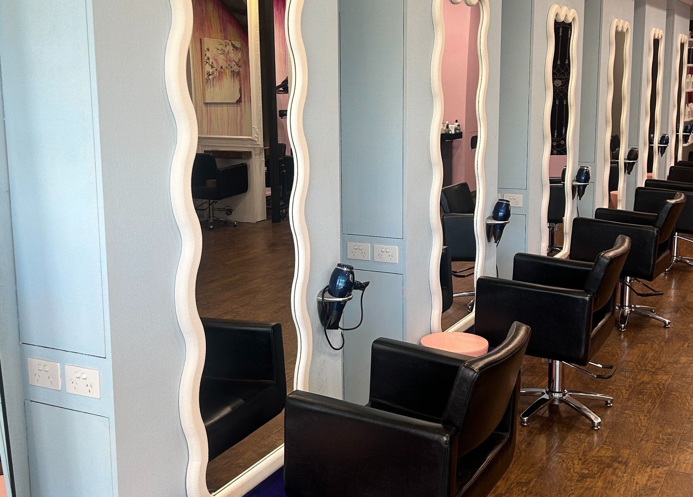 Stylish salon interior at Charlie Joy Salon, Caringbah, New South Wales, AU, with elegant styling stations.