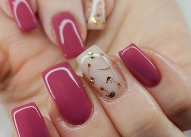 Stylish nail art with pink polish and gold accents at Your Nail World, Haarlem, NL.