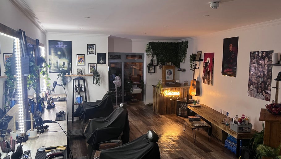 Interior of Cult barbers featuring stylish decor in Coventry, England, GB with illuminated mirrors and rustic charm.