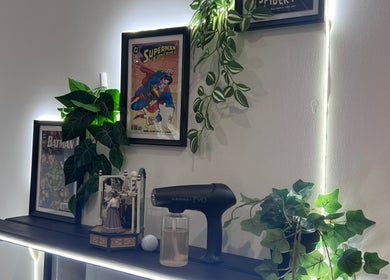 Cult Barbers in Coventry, England, GB features stylish decor with comic posters and modern equipment.