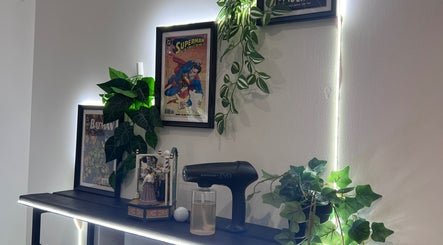 Cult Barbers in Coventry, England, GB features stylish decor with comic posters and modern equipment.
