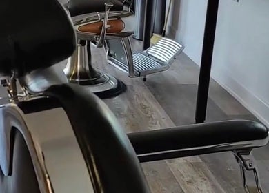 Modern barber chair at Cult Barbers, Coventry, England, GB, showcasing sleek design and comfort.