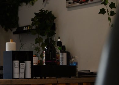 Product display at Cult barbers in Coventry, England, GB showcasing premium grooming products and decor.