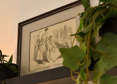 Framed vintage barber print and plants at Cult Barbers, Coventry, England, GB.