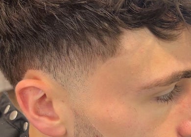 Close-up of a stylish fade haircut at Cult Barbers, Coventry, England, GB, showcasing expert barbering skills.
