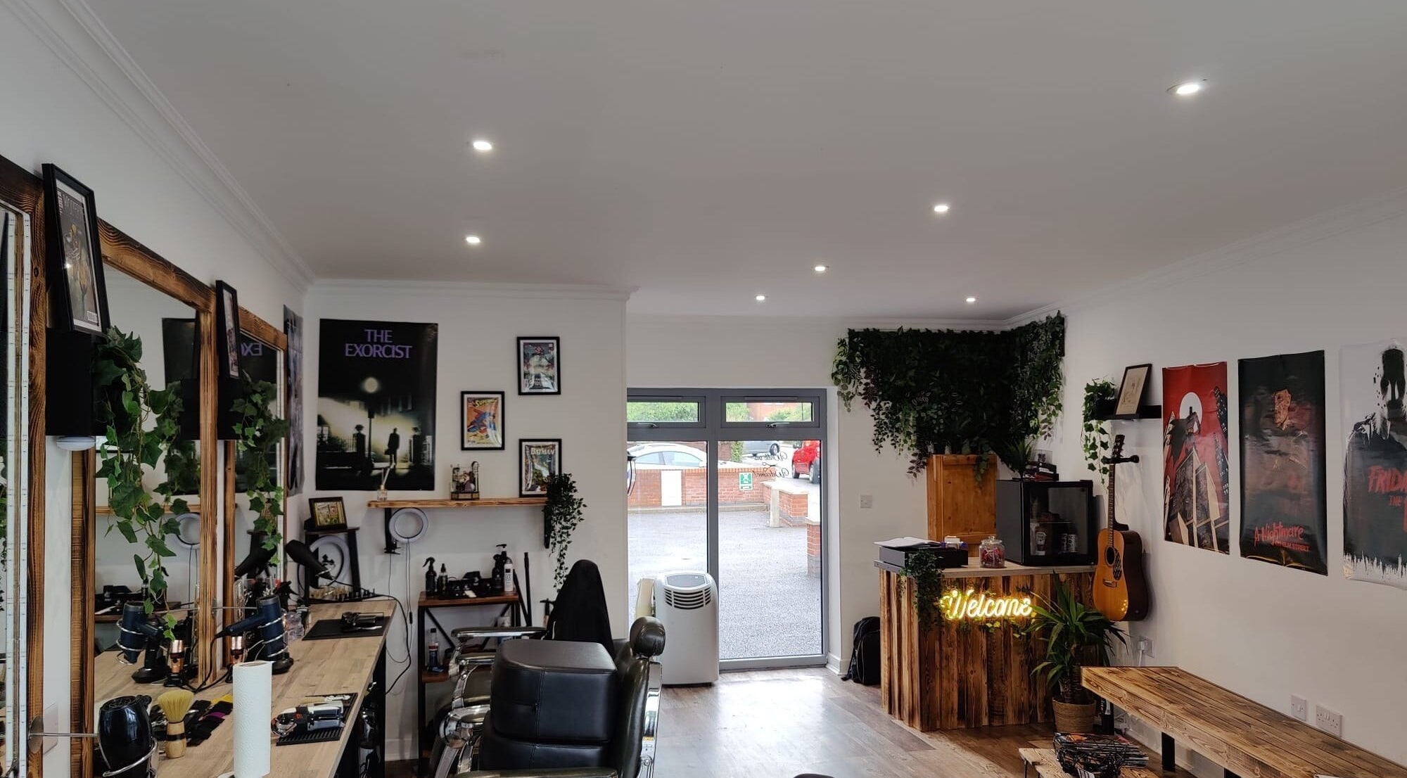 Chic interior of Cult Barbers, Coventry, England, GB with mirrors, chairs, and stylish decor.