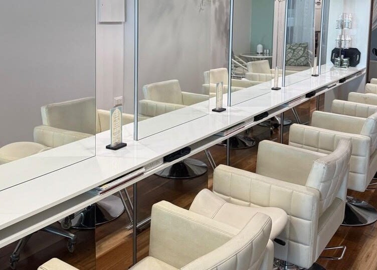 Elegant salon chairs at Heads In The Cloud, Buderim, Queensland, AU, offering a tranquil beauty experience.