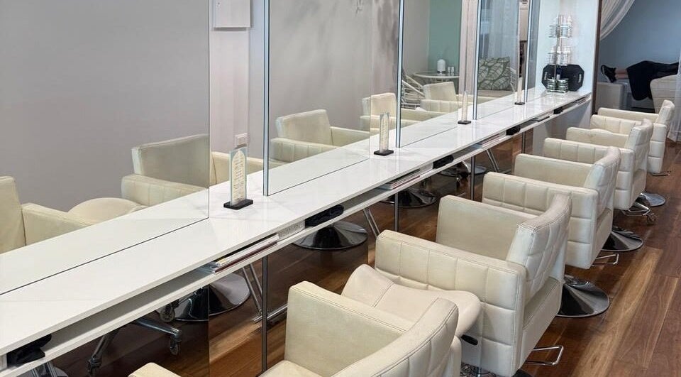 Elegant salon chairs at Heads In The Cloud, Buderim, Queensland, AU, offering a tranquil beauty experience.