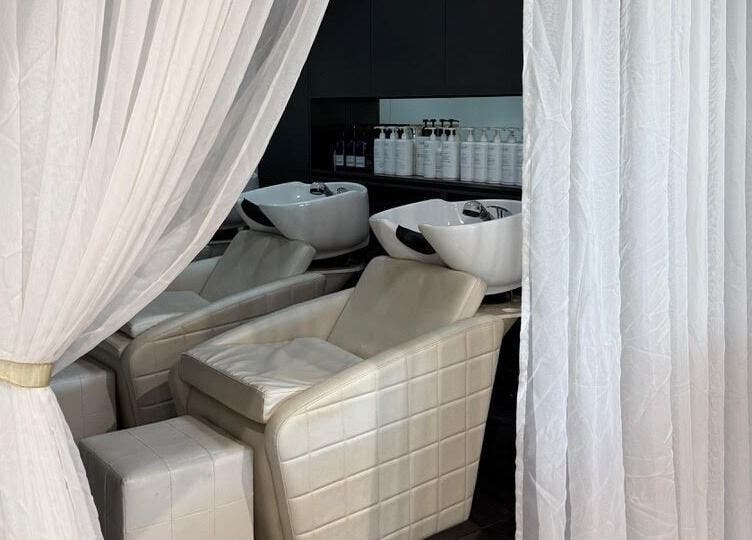Luxurious hair wash stations at Heads In The Cloud, Buderim, Queensland, AU elegantly curtained for privacy.