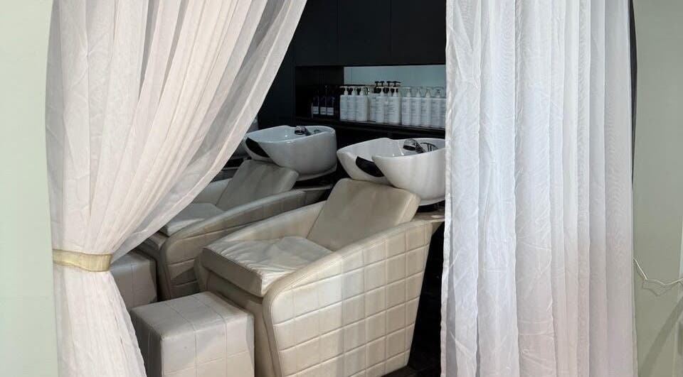 Luxurious hair wash stations at Heads In The Cloud, Buderim, Queensland, AU elegantly curtained for privacy.