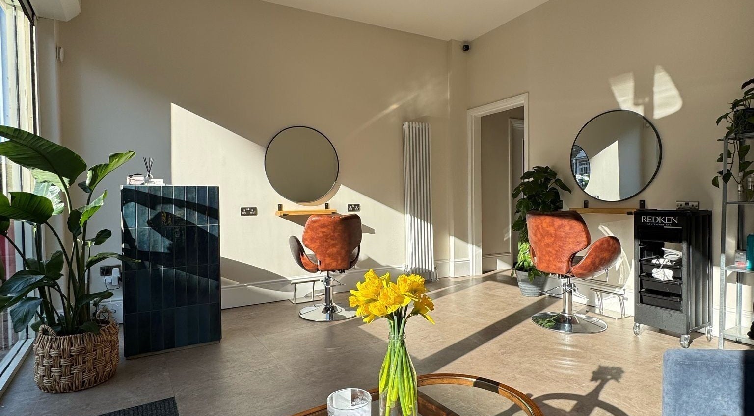 Bright, inviting salon space at Grace Hairstylist, Leicester, England, GB, featuring stylish chairs and decor.