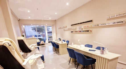 Interior view of Poise & Polish Beauty Bar in Cape Town, Western Cape, ZA showcasing manicure stations and pedicure chairs.