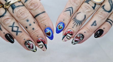 Intricate nail art design at Poise & Polish Beauty Bar, Cape Town, Western Cape, ZA showcases tattoo-inspired styles.