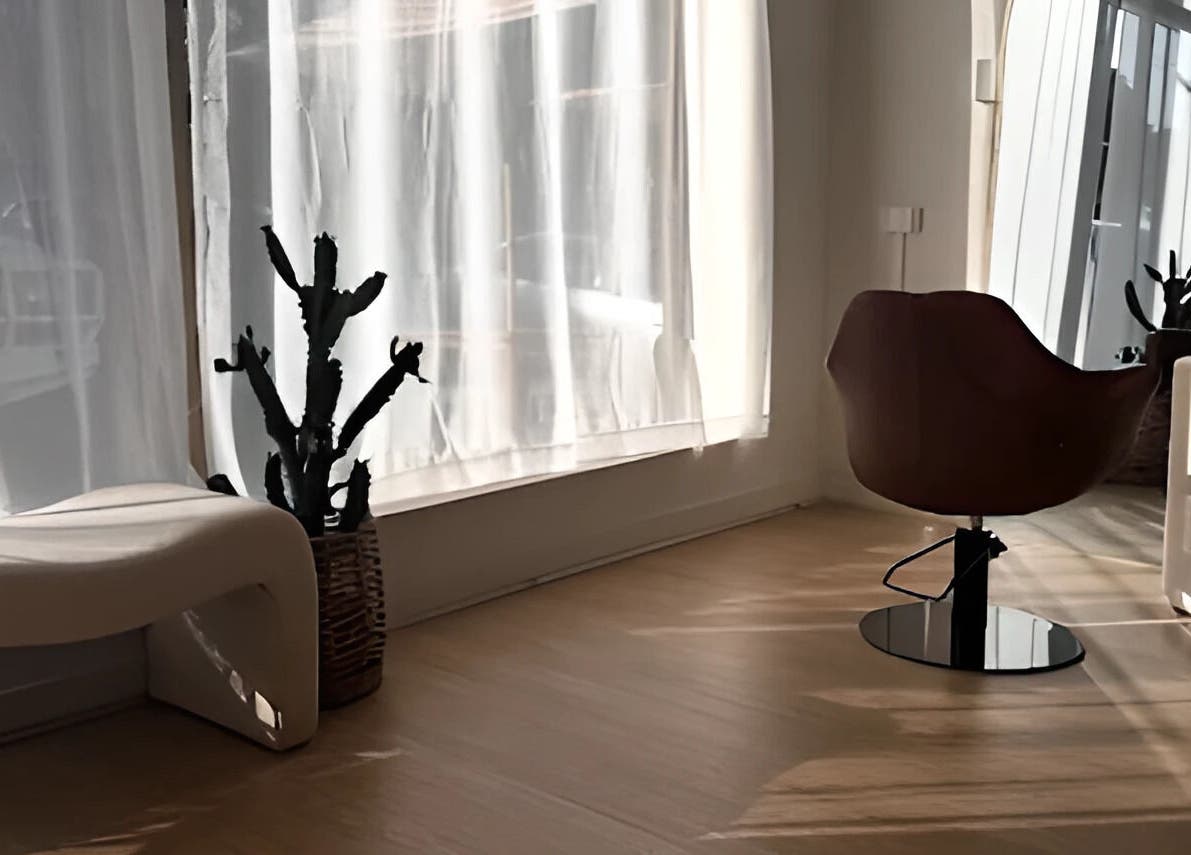 Sunlit interior at Hair By Eden Carruthers, Melbourne, Victoria, AU, featuring elegant decor and seating.