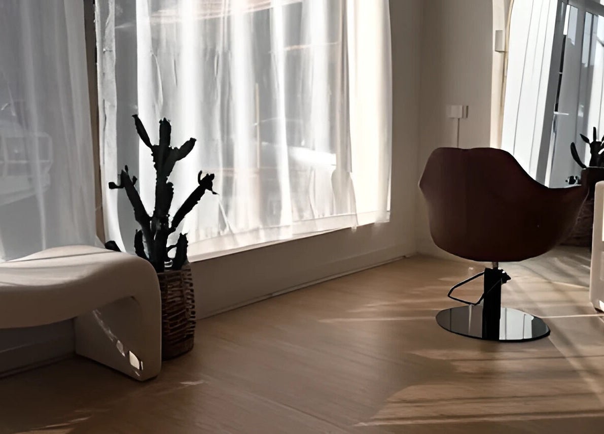 Sunlit interior at Hair By Eden Carruthers, Melbourne, Victoria, AU, featuring elegant decor and seating.