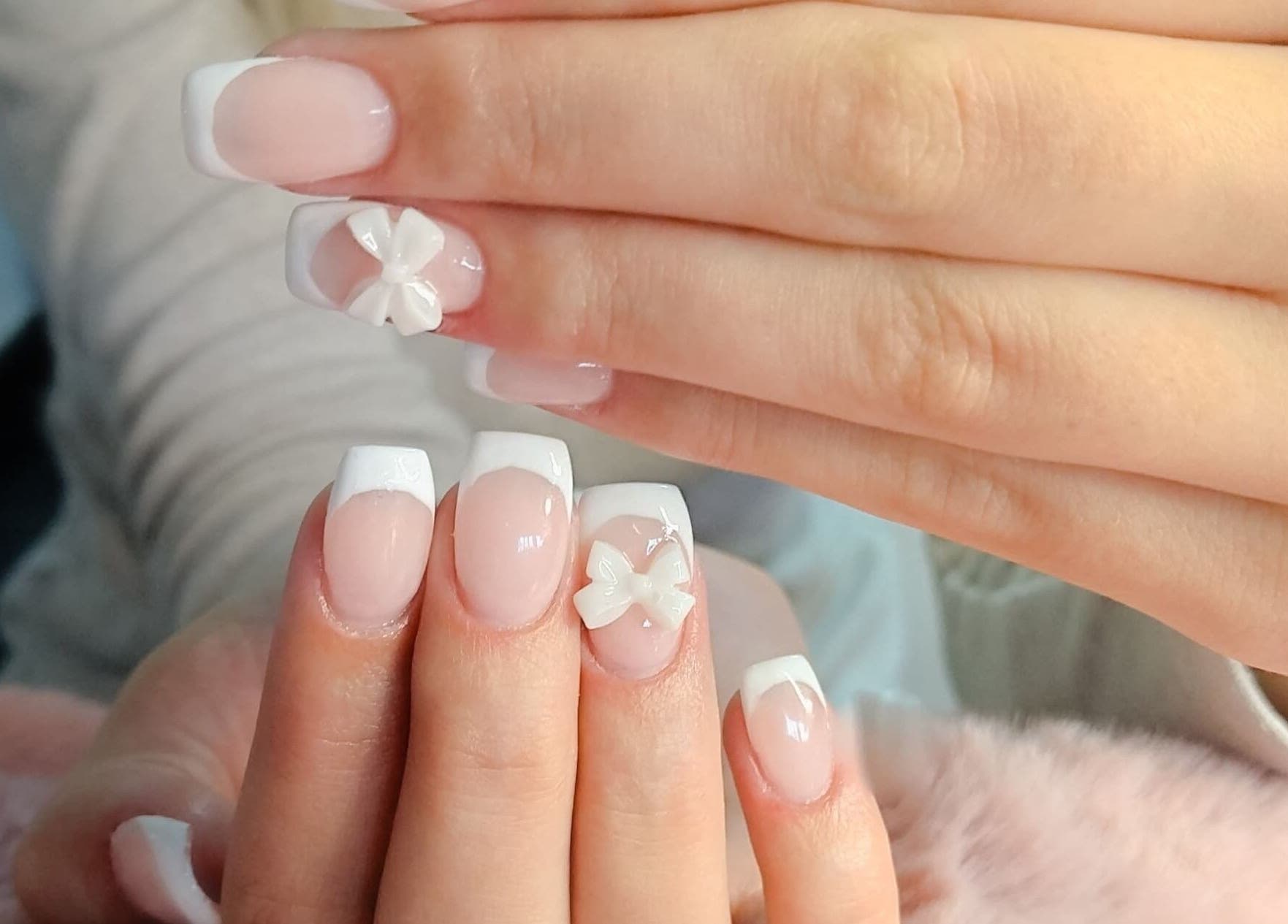 Elegant French manicure with 3D floral designs at Nails By Kim, Pretoria, Gauteng, ZA.