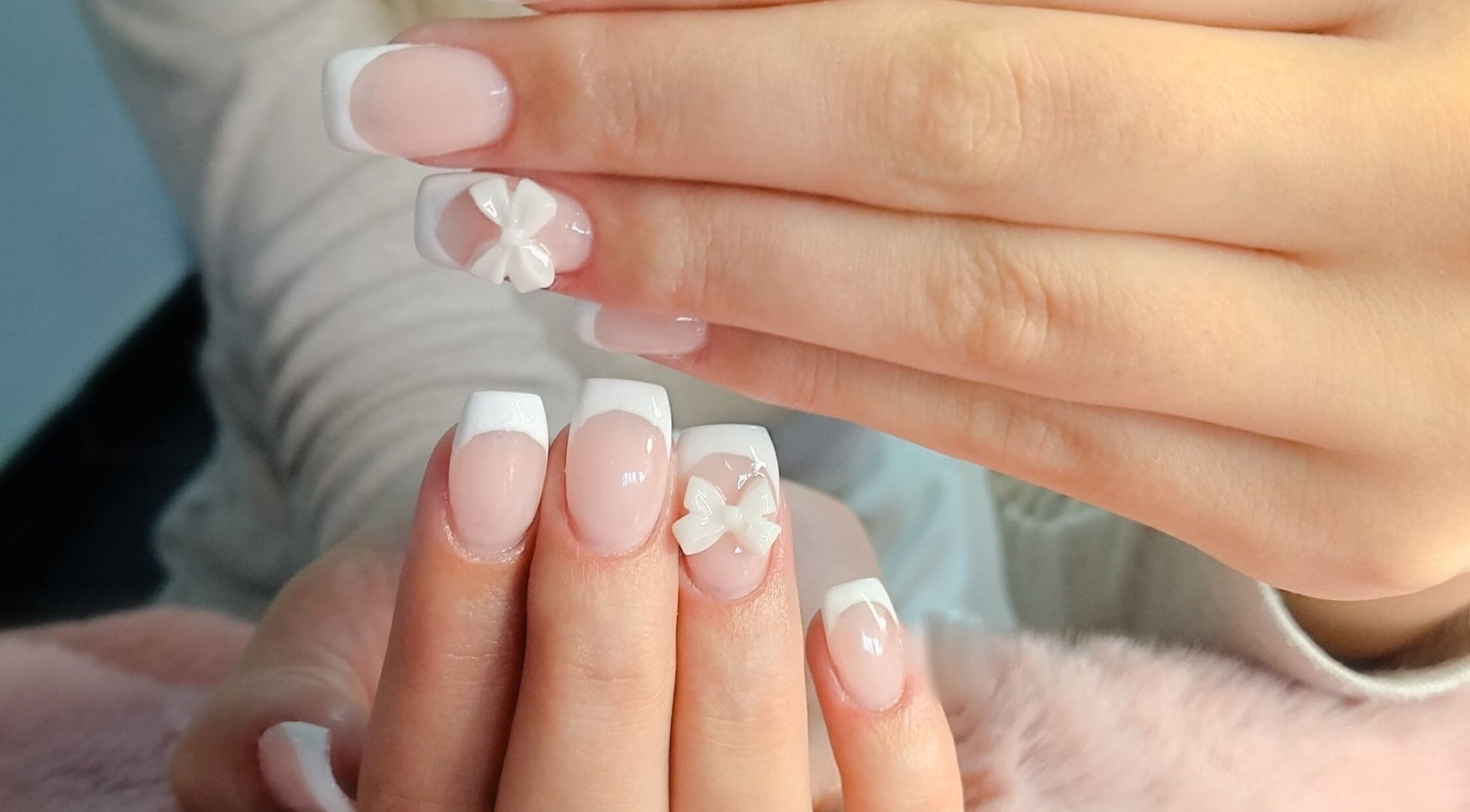 Elegant French manicure with 3D floral designs at Nails By Kim, Pretoria, Gauteng, ZA.