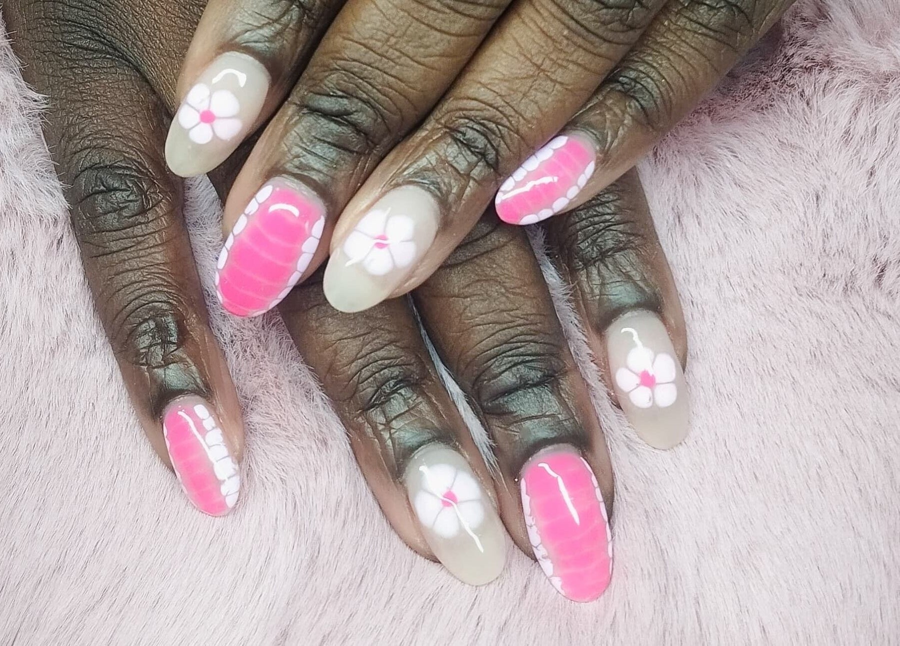 Elegant floral nail art at Nails By Kim in Pretoria, Gauteng, ZA, showcasing intricate pink and white designs.