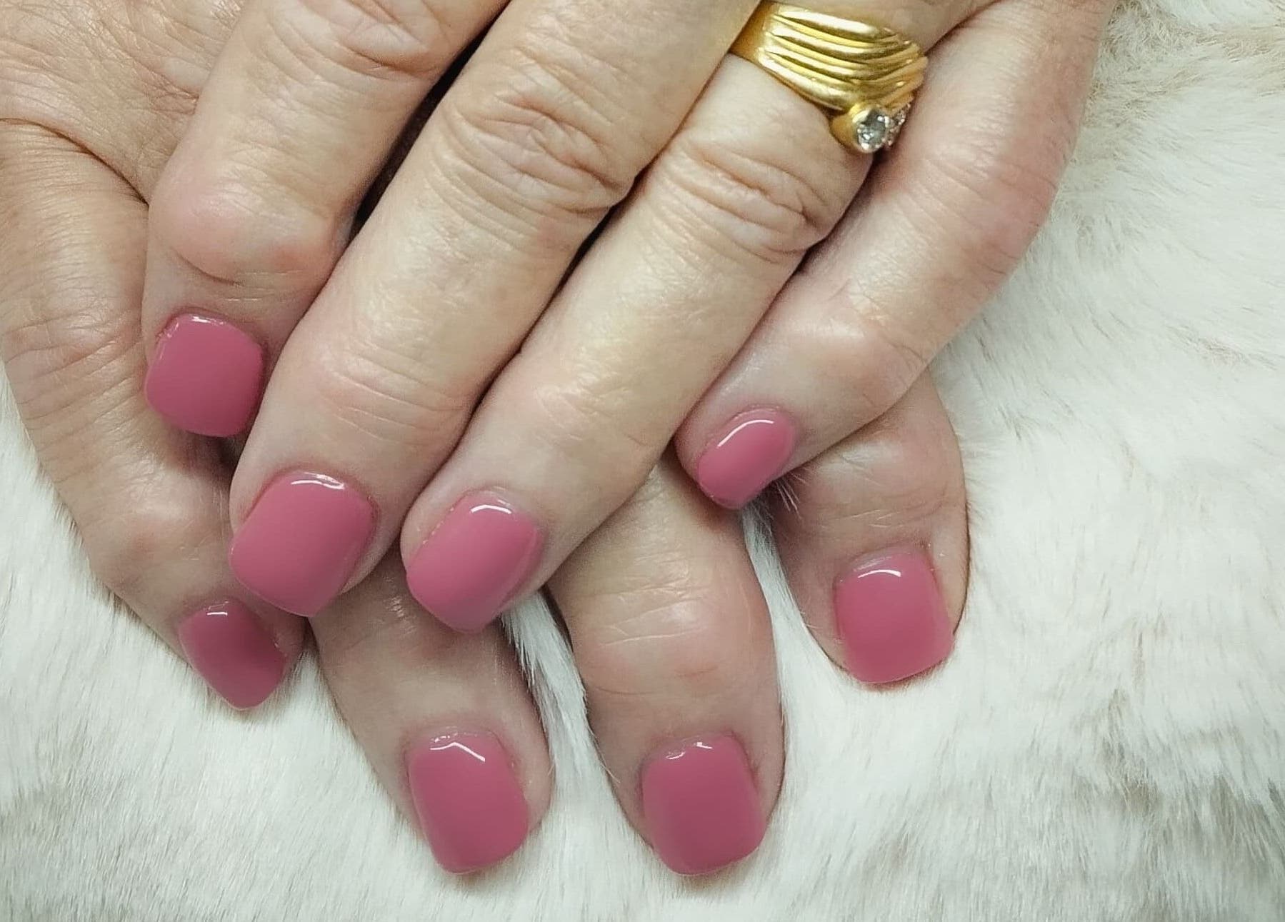 Elegant pink manicure at Nails By Kim in Pretoria, Gauteng, ZA, showcasing perfectly polished nails.