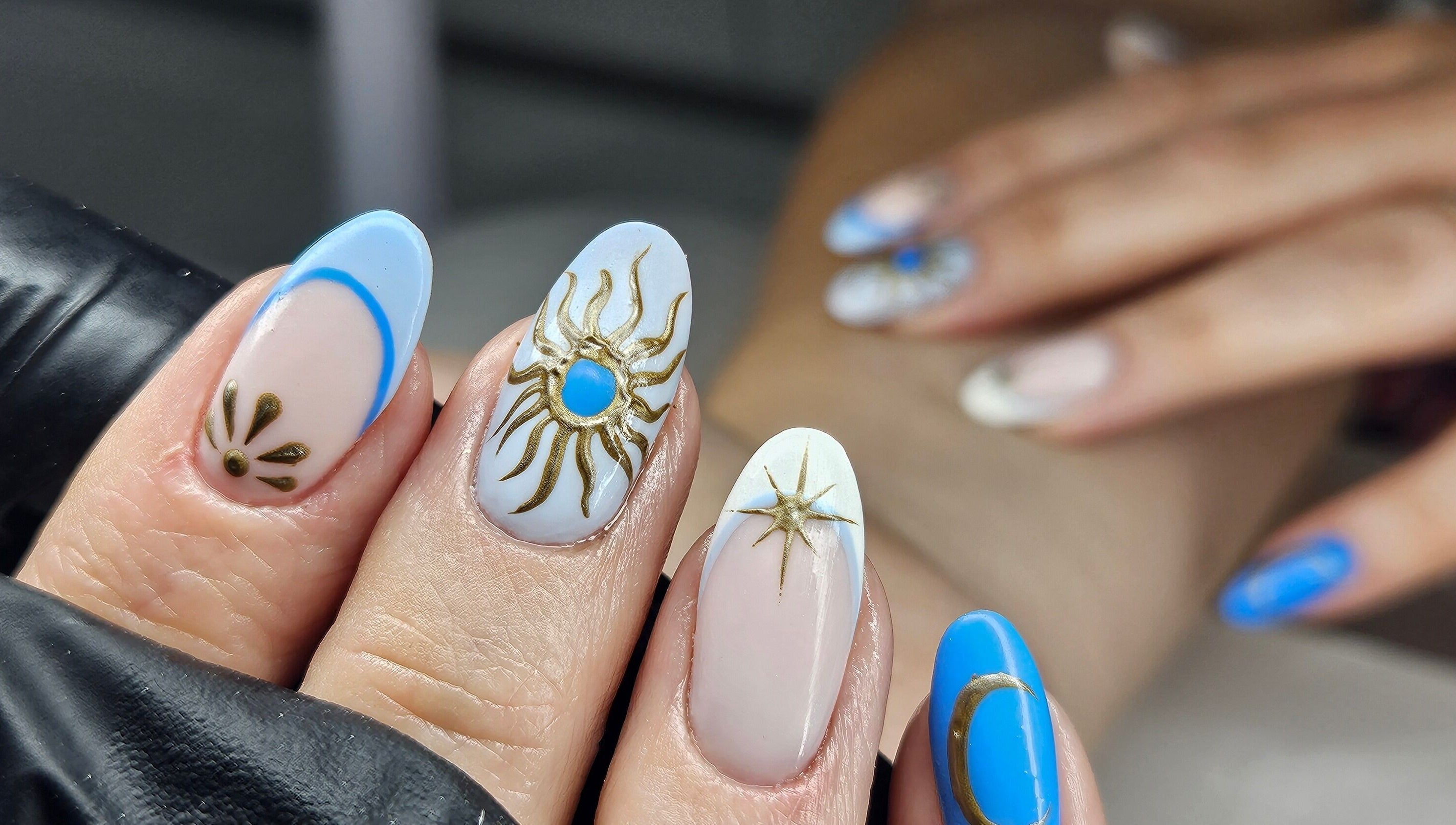 Celestial-themed nail art at cwbeautyofficial in Milnrow, England, GB showcasing intricate design.