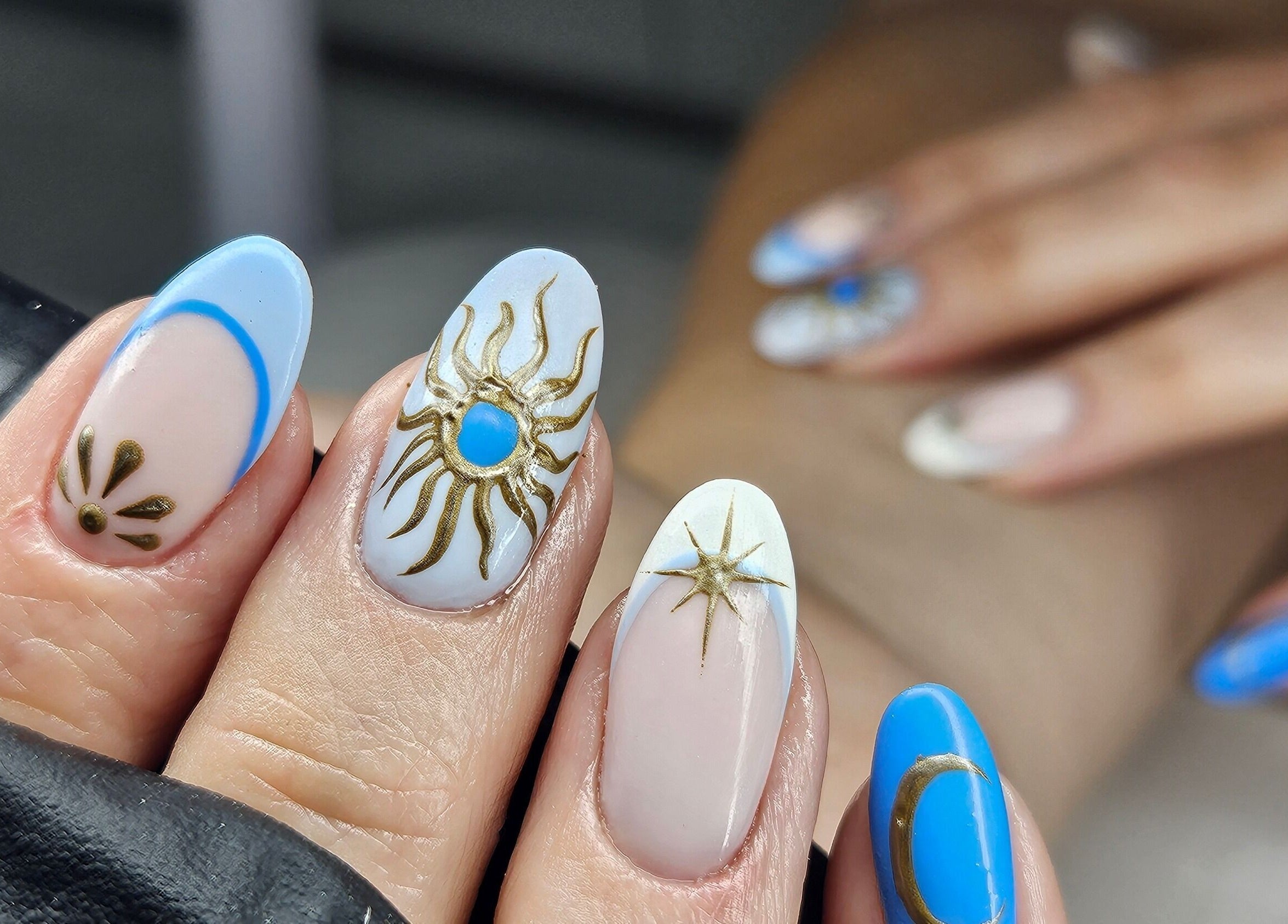 Celestial-themed nail art at cwbeautyofficial in Milnrow, England, GB showcasing intricate design.