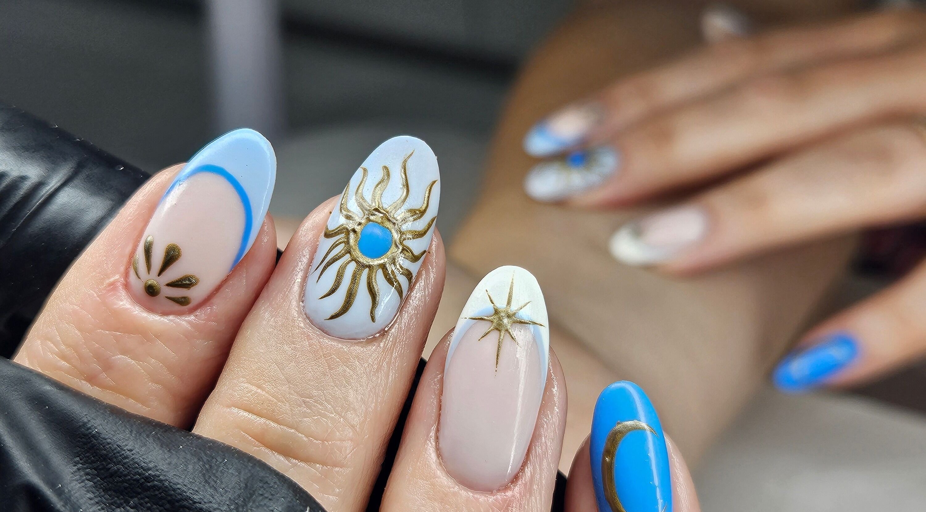 Celestial-themed nail art at cwbeautyofficial in Milnrow, England, GB showcasing intricate design.