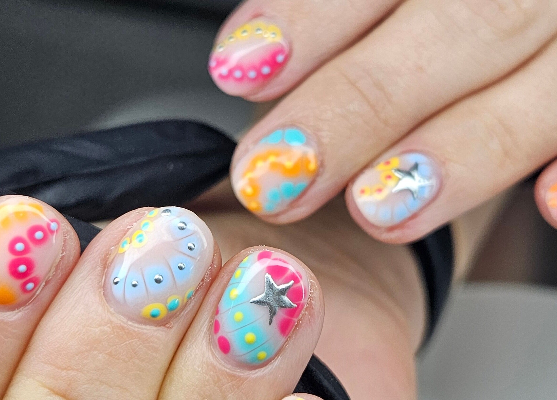 Colorful nail art with star details at cwbeautyofficial, Milnrow, England, GB.