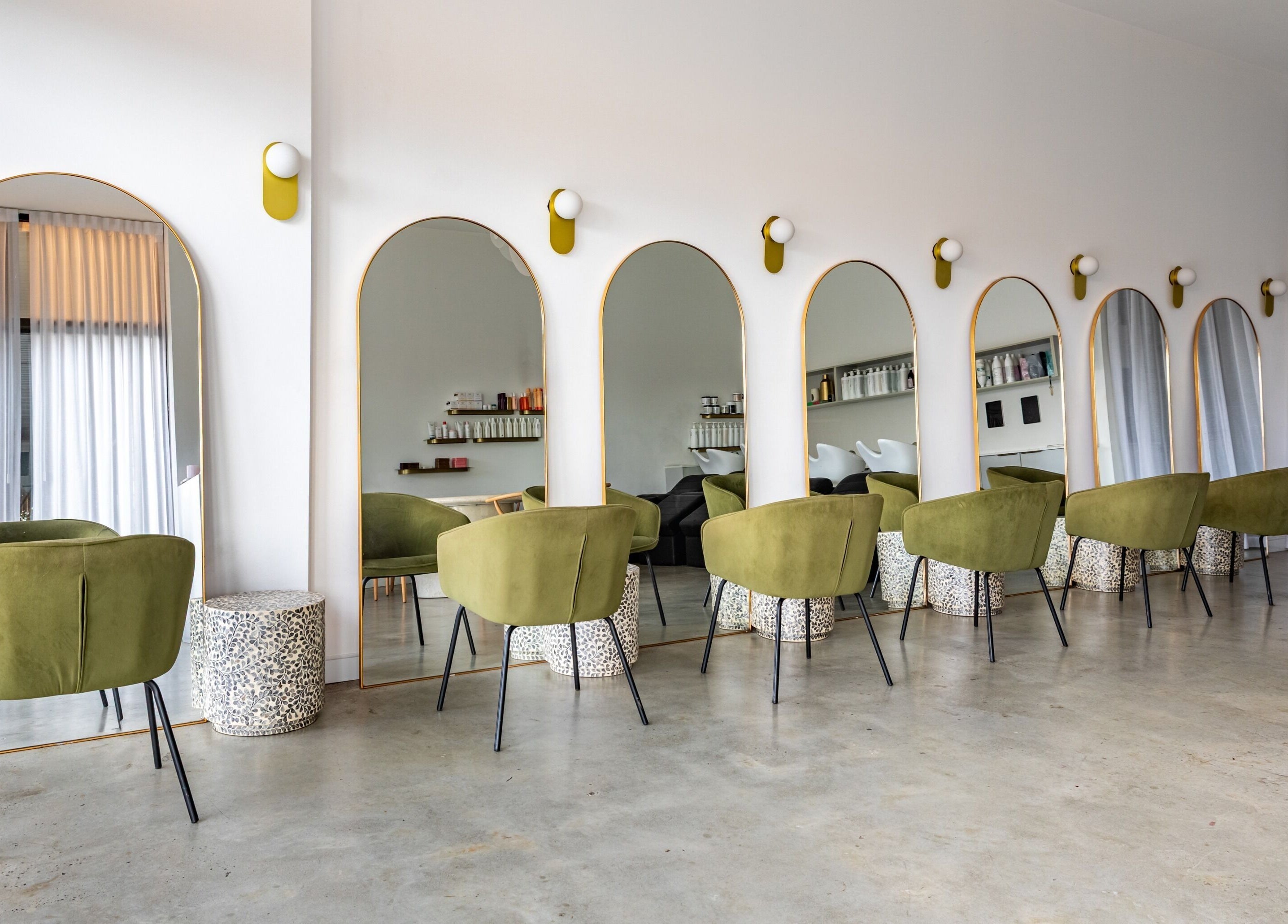 Chic styling chairs and large mirrors at Cali Studio in Campbell, Australian Capital Territory, AU.