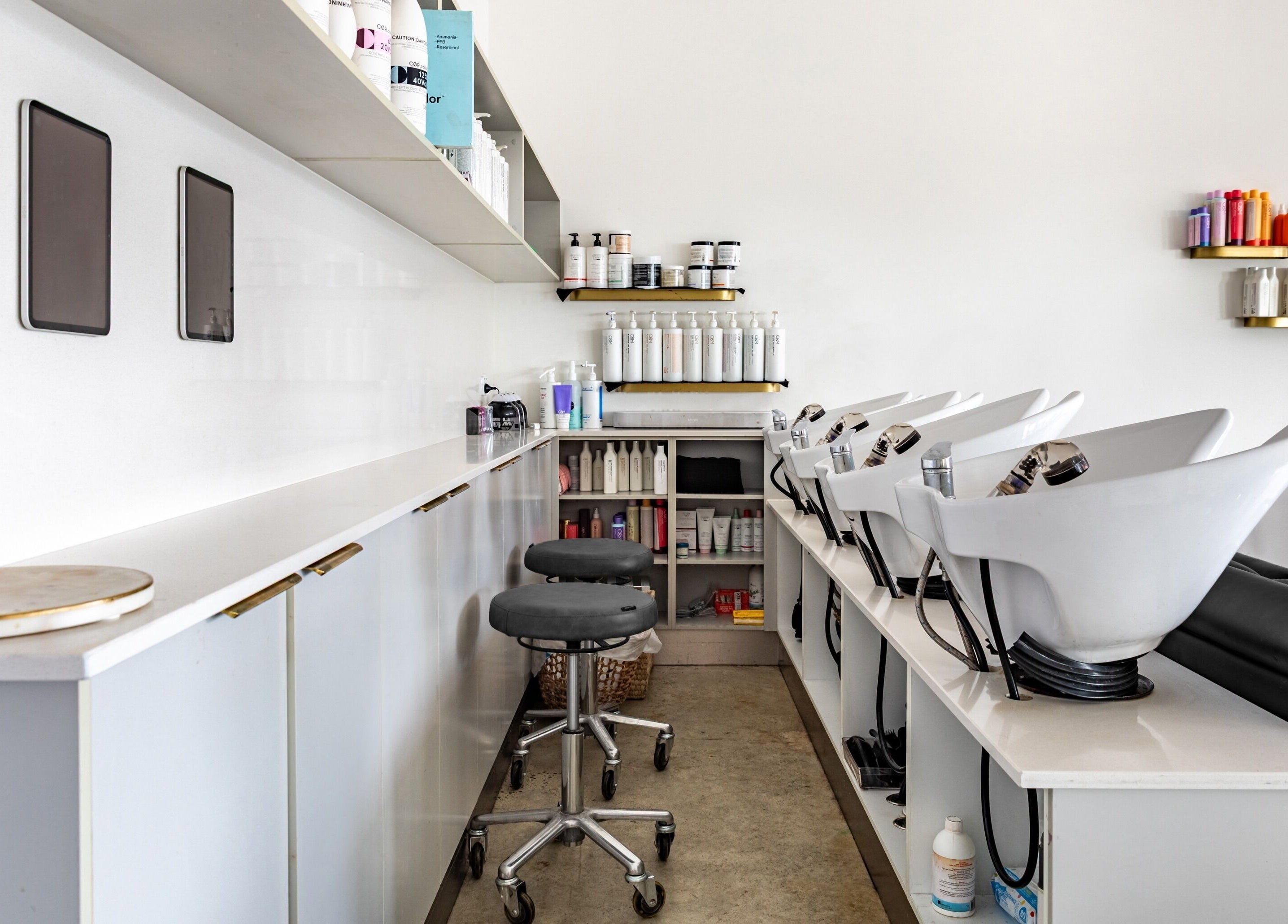 Cali Studio's sleek wash area in Campbell, Australian Capital Territory, AU, featuring modern salon equipment.