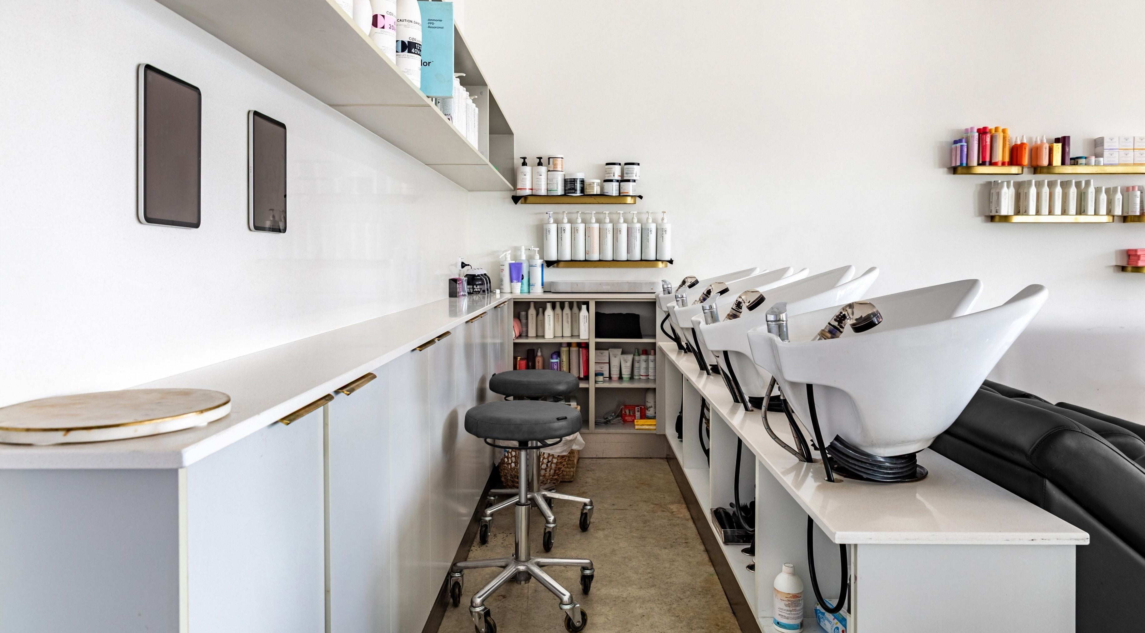 Cali Studio's sleek wash area in Campbell, Australian Capital Territory, AU, featuring modern salon equipment.