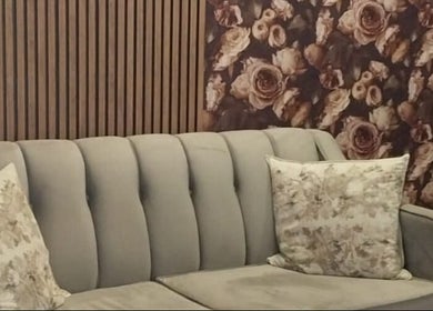 Elegant grey sofa with floral cushions at Glow Align, Pretoria, Gauteng, ZA.