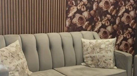 Elegant grey sofa with floral cushions at Glow Align, Pretoria, Gauteng, ZA.