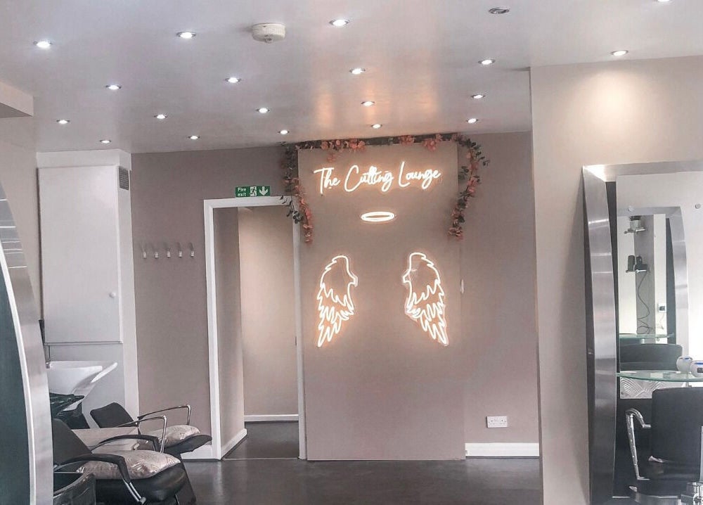 Elegant interior of BabesLengths in Blackpool, England, with stylish decor and modern salon chairs.