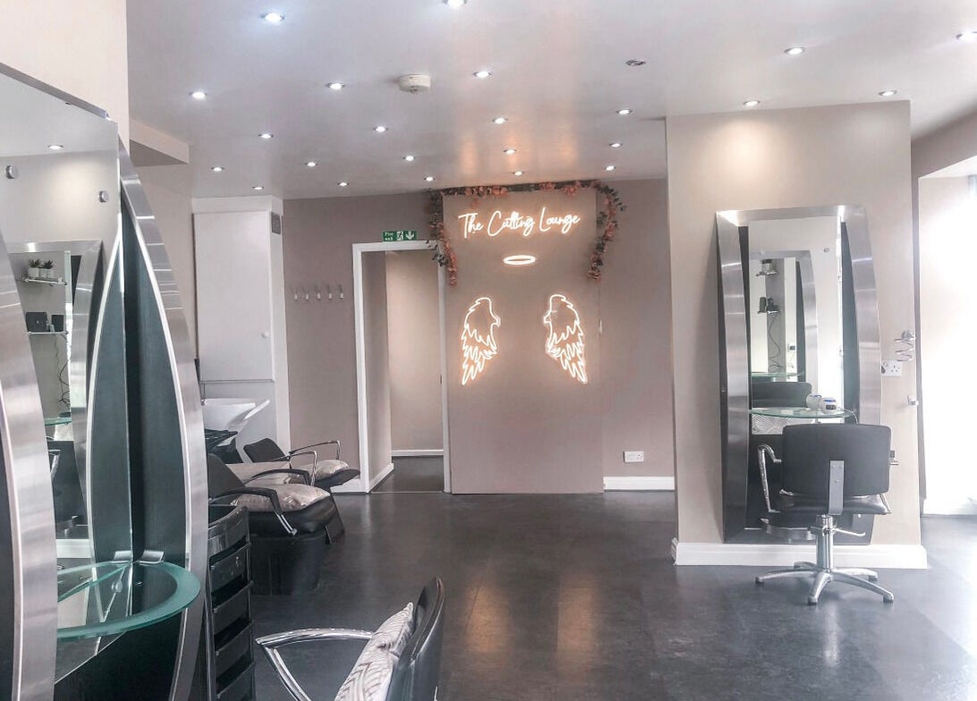 Modern salon interior at BabesLengths, Blackpool, England, GB, with chic mirrors and elegant decor.