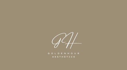 Golden Hour Aesthetics logo in Derby, England, GB on a beige background.