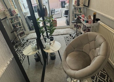 Relaxing seating area at ChloeMossHair&Beauty in Sudbrooke, England, GB, featuring elegant decor and styling setup.