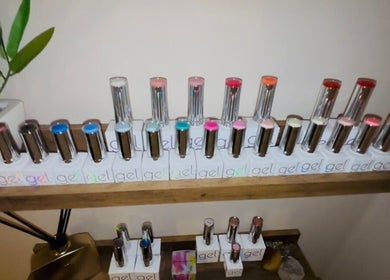 Gel nail polishes on display at Solely Elegant, Thornaby, England, GB, showcase vibrant color options.