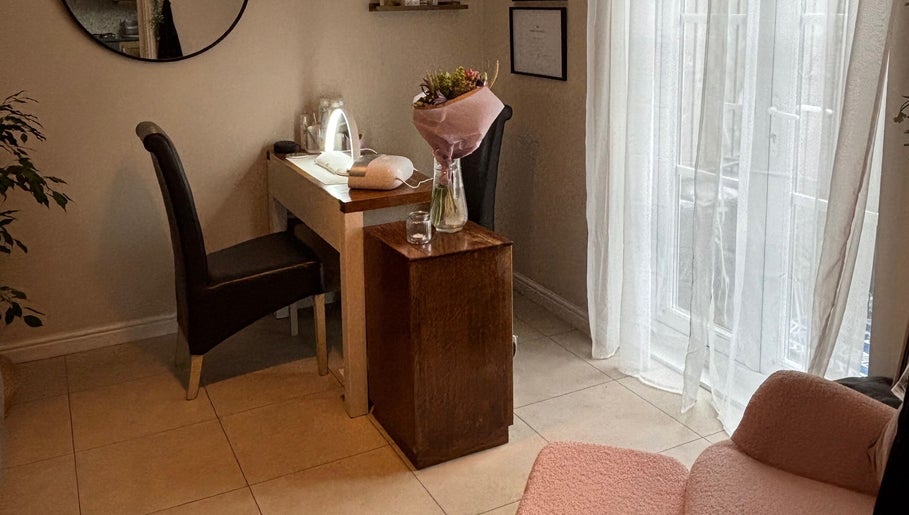 Elegant beauty corner at Solely Elegant, Thornaby, England, GB, featuring a styled chair and table setup.