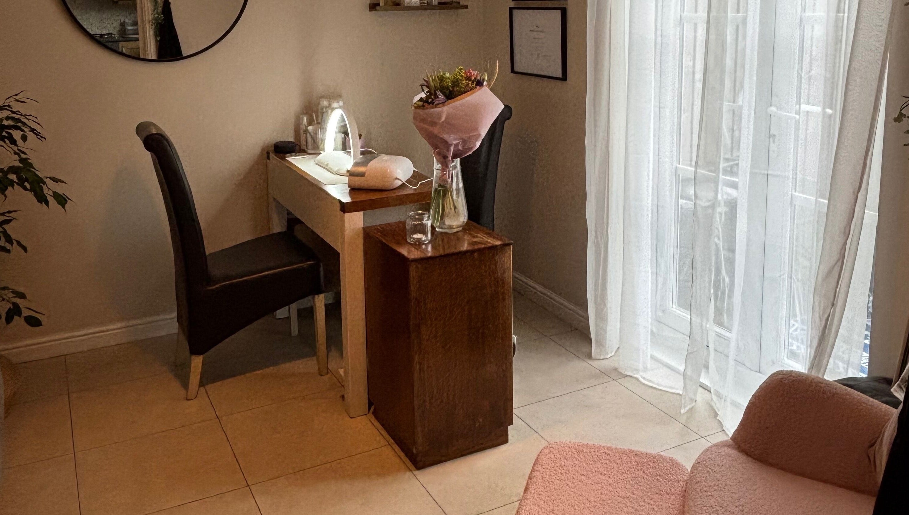 Elegantly arranged beauty station at Solely Elegant, Thornaby, England, GB, featuring cozy seating and floral decor.