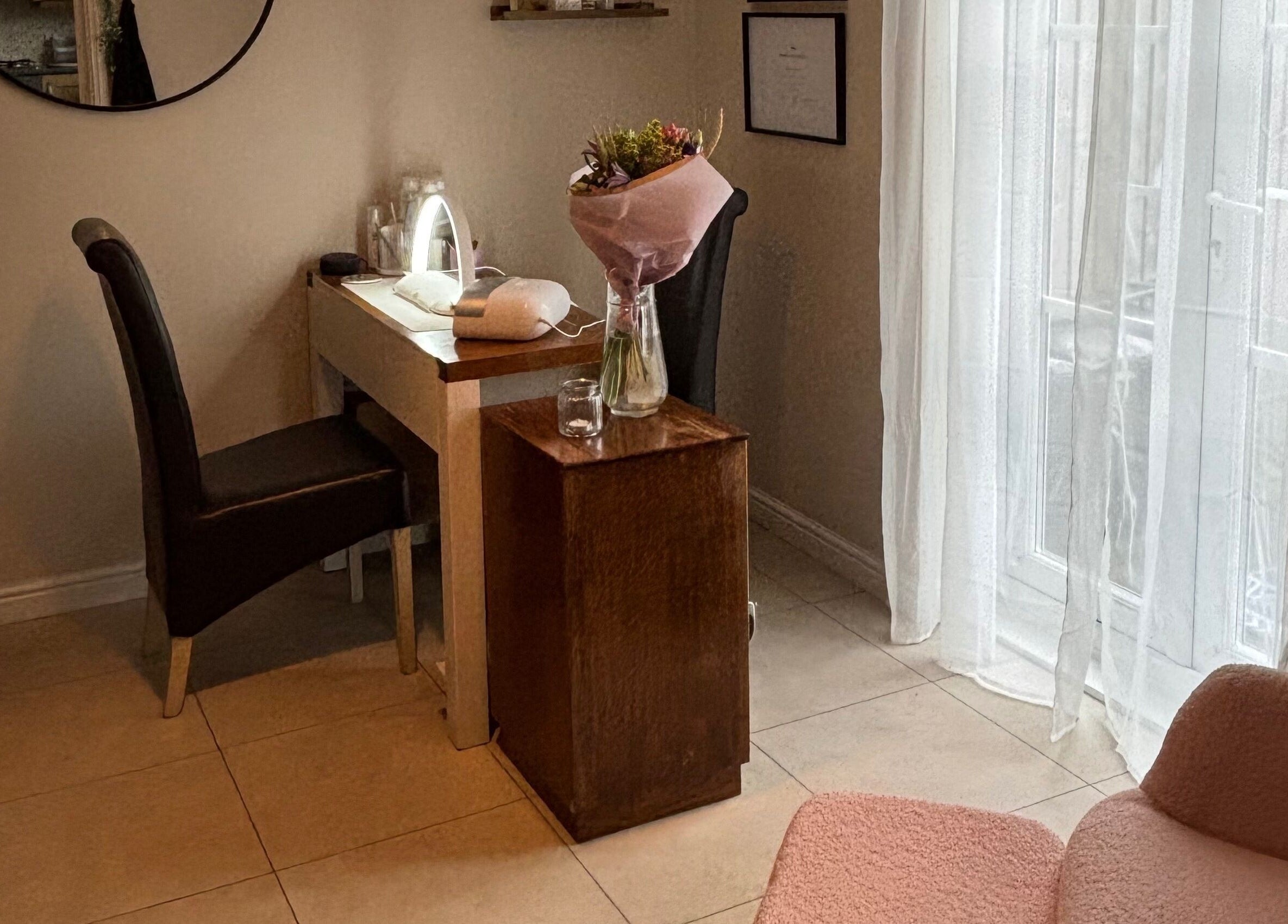 Elegantly arranged beauty station at Solely Elegant, Thornaby, England, GB, featuring cozy seating and floral decor.