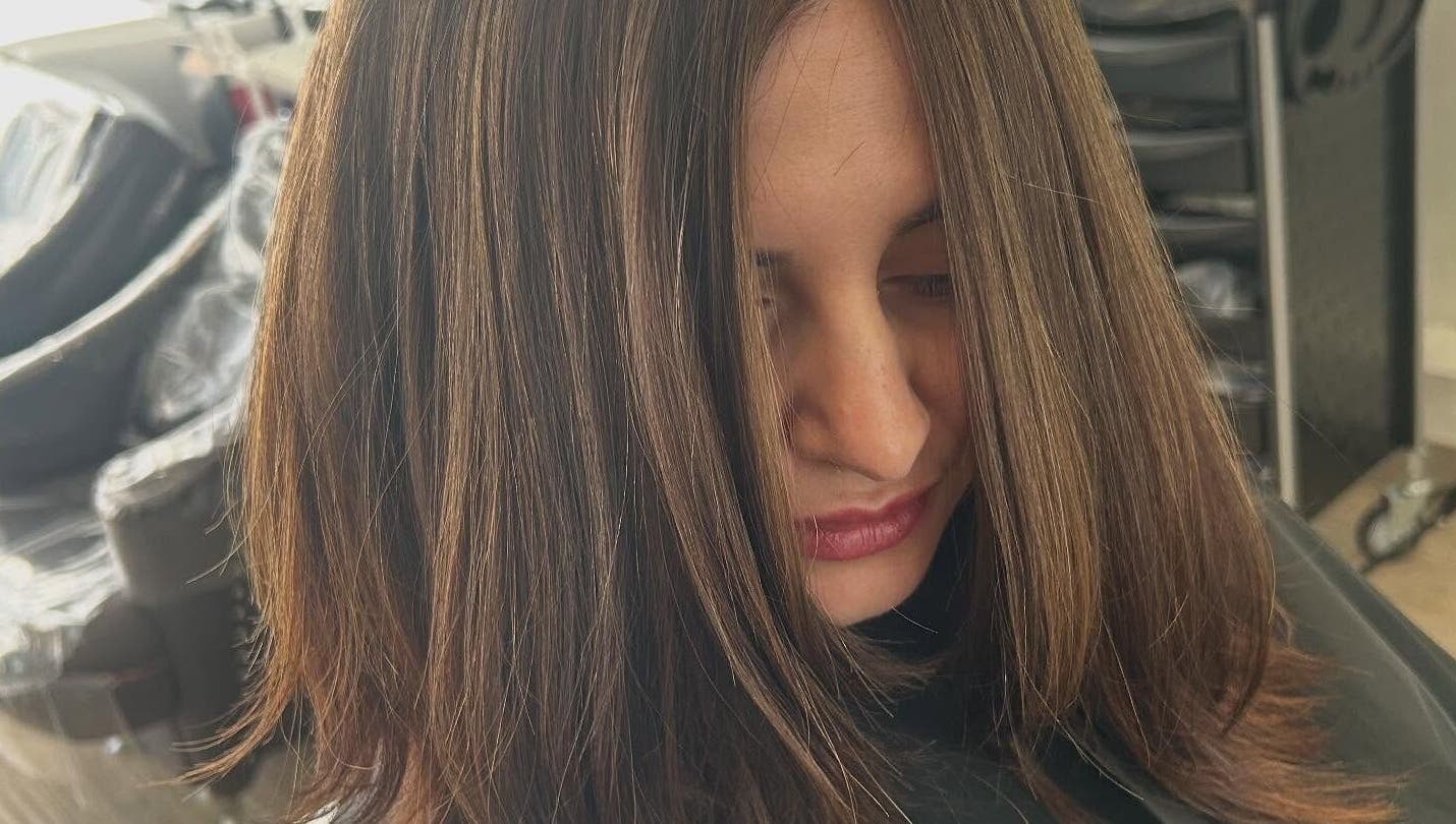 Stylish brunette hairstyle at Sian's Hairdressing in Nuneaton, England, GB showcasing silky smooth hair.