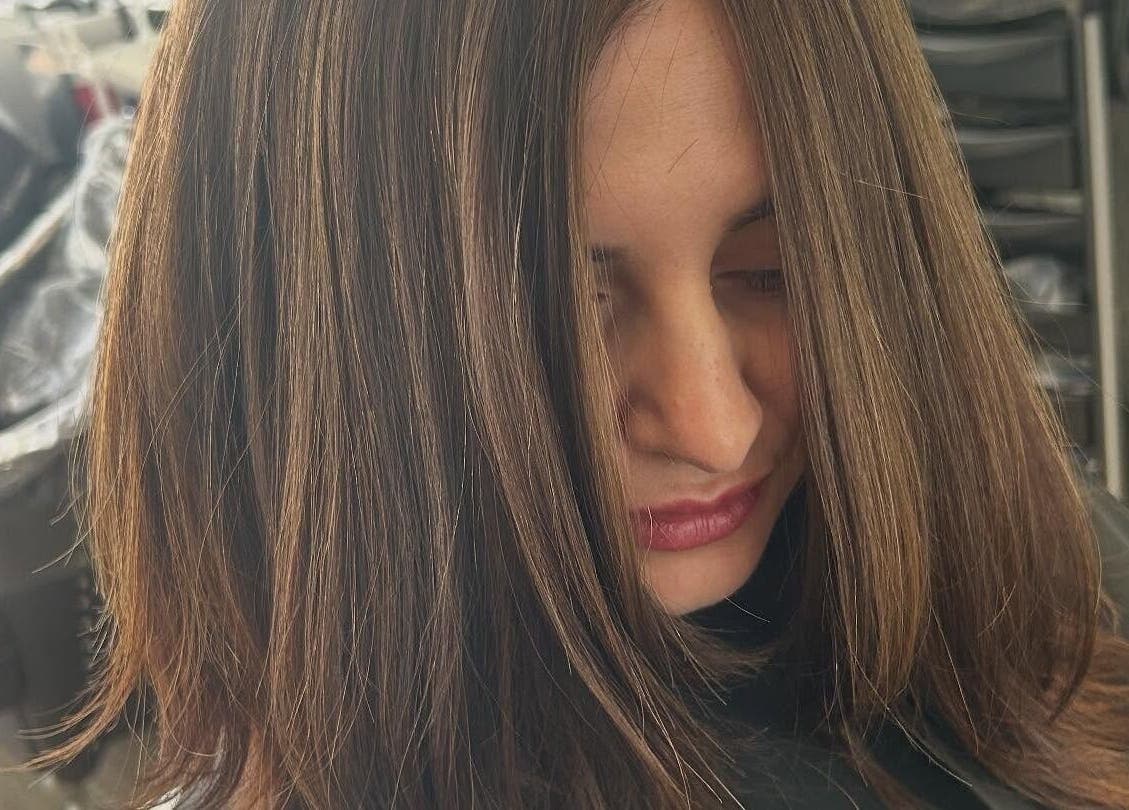 Stylish brunette hairstyle at Sian's Hairdressing in Nuneaton, England, GB showcasing silky smooth hair.