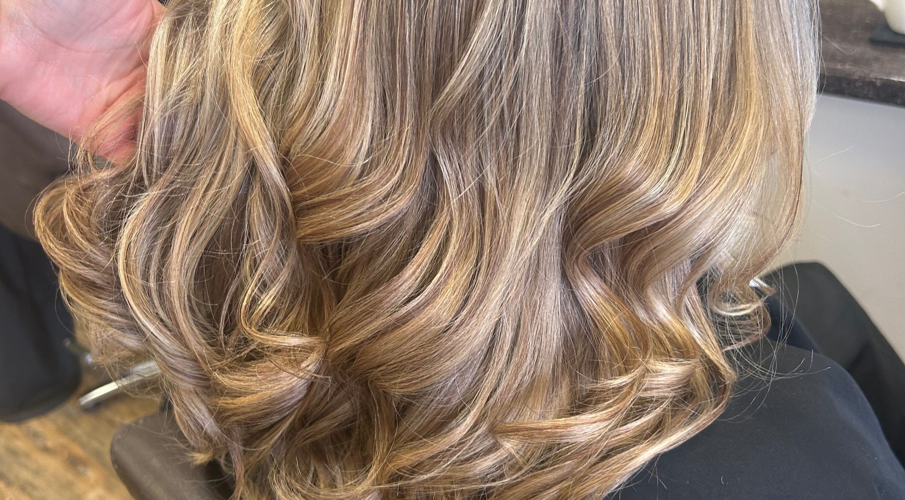 Golden wavy hairstyle at Sian’s Hairdressing in Nuneaton, England, GB. Perfect for modern hair transformation.