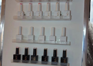 Nail polish selection at Macie Jones Studios, Aberdare, Wales, GB, highlighting premium beauty products.